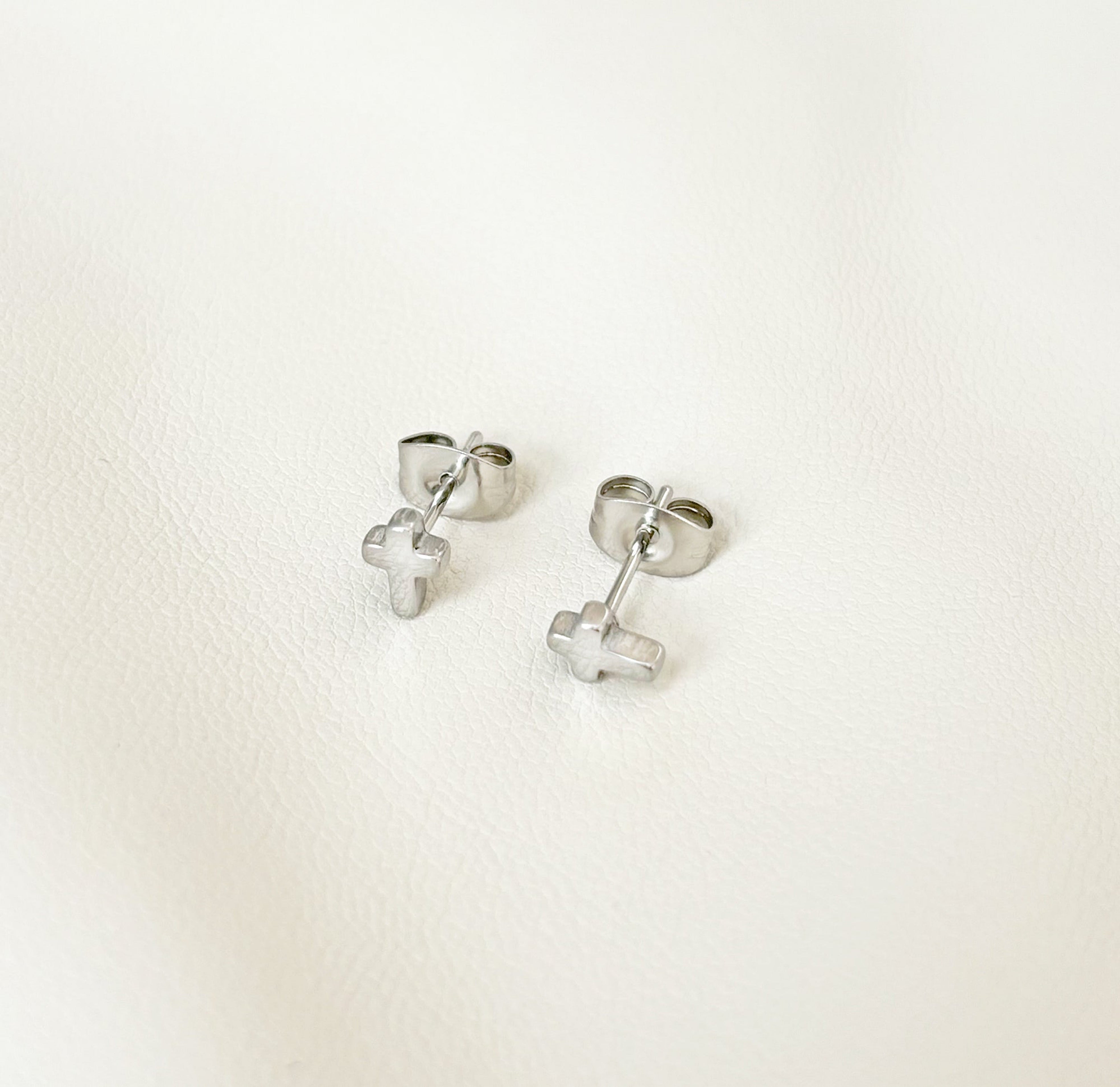 dainty silver cross stud earrings