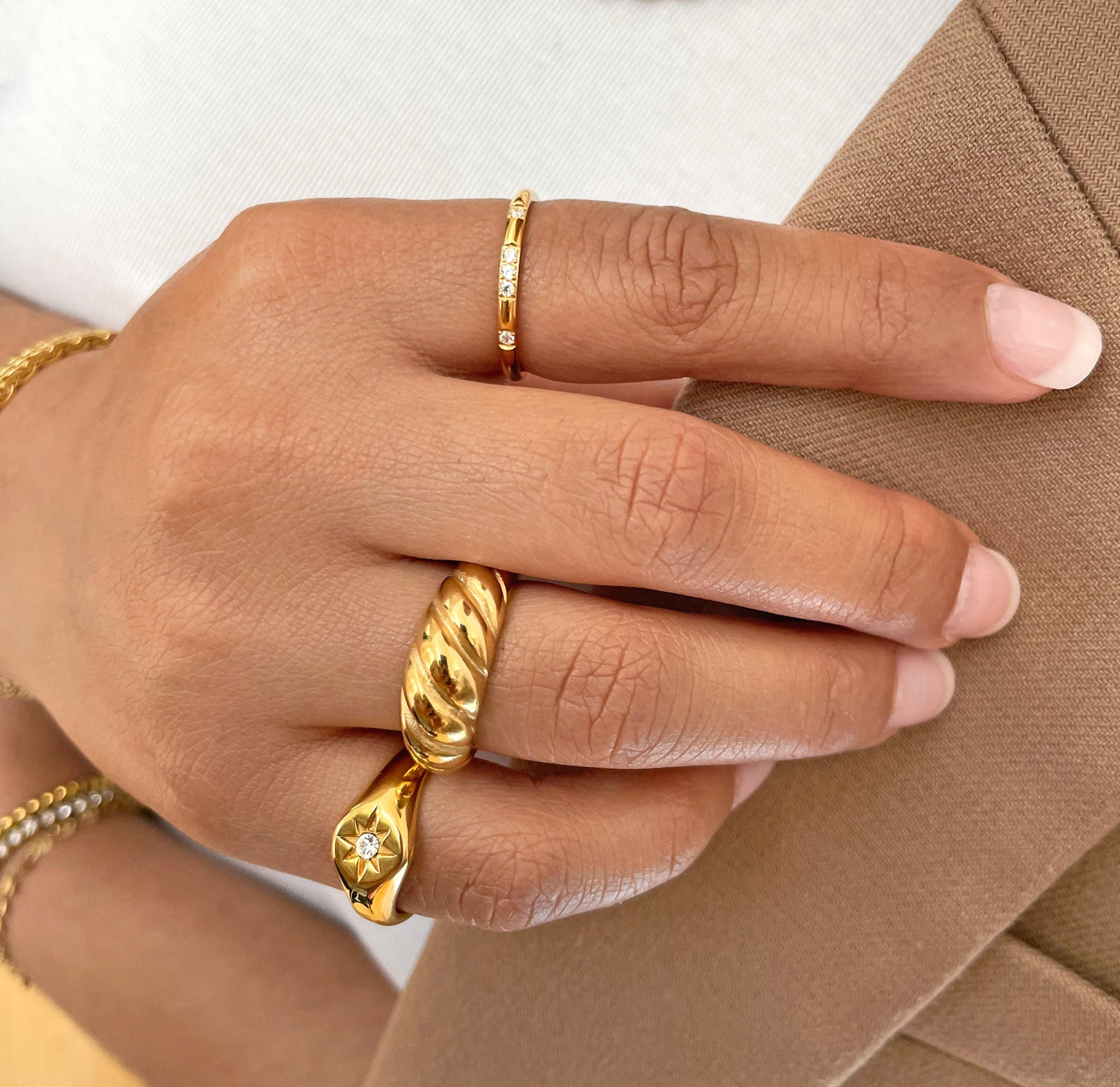 Veda thin gold pave ring band paired with pave dome ring paired with gold croissant ring.. Gold waterproof jewelry