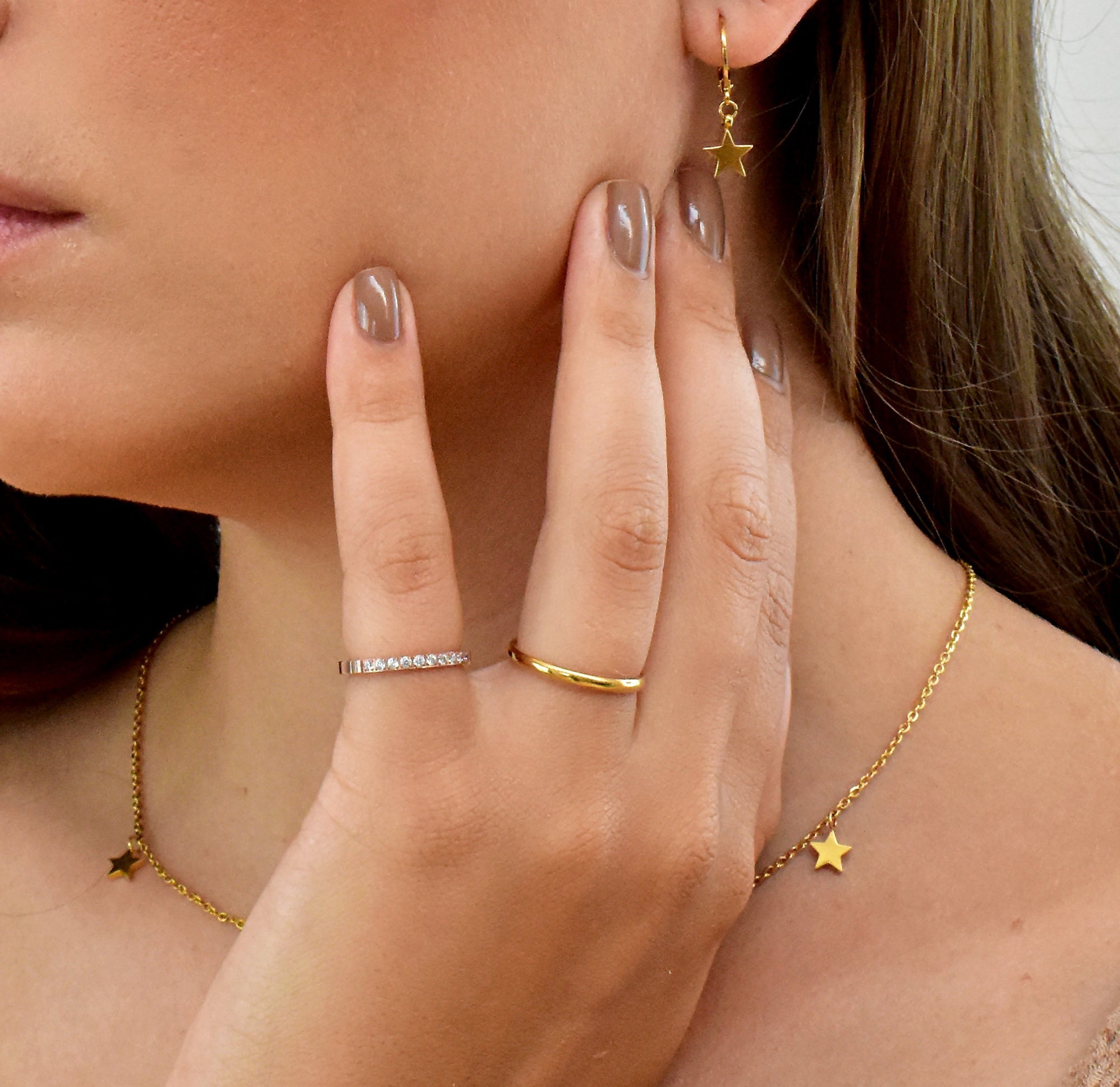 Didi thin gold ring band paired with Stella hand eternity ring worn on model, waterproof rings