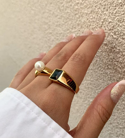 gold onyx signet ring paired with Joe pearl ring worn on model. Waterproof jewelry