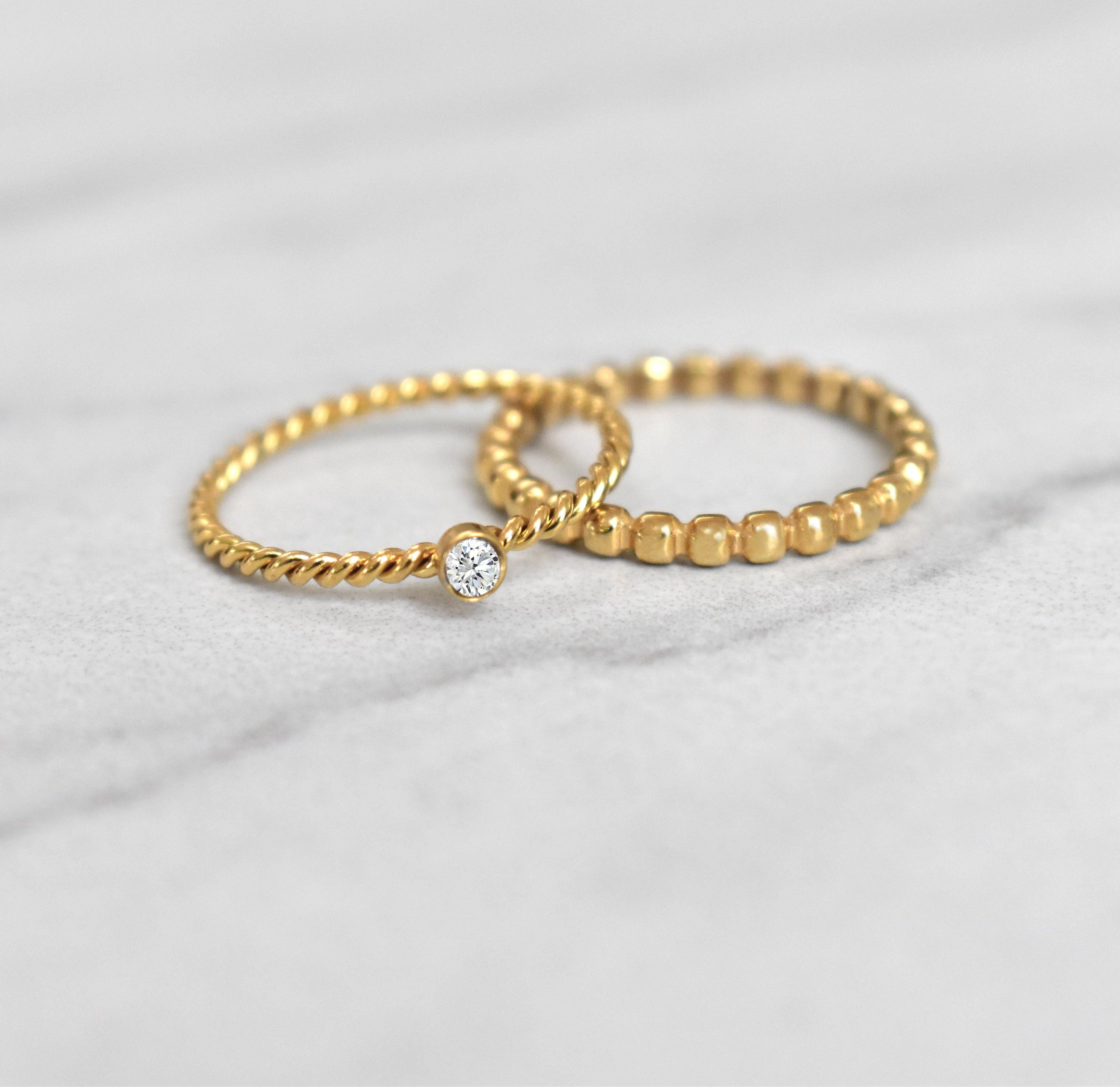 Jaina thin gold beaded ring paired with Dainty twist solitaire ring. Waterproof jewelry