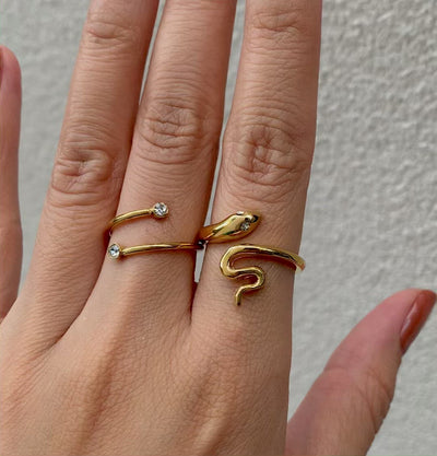 Sylvie gold spiral ring paired with Solange gold snake ring. Gold waterproof jewelry