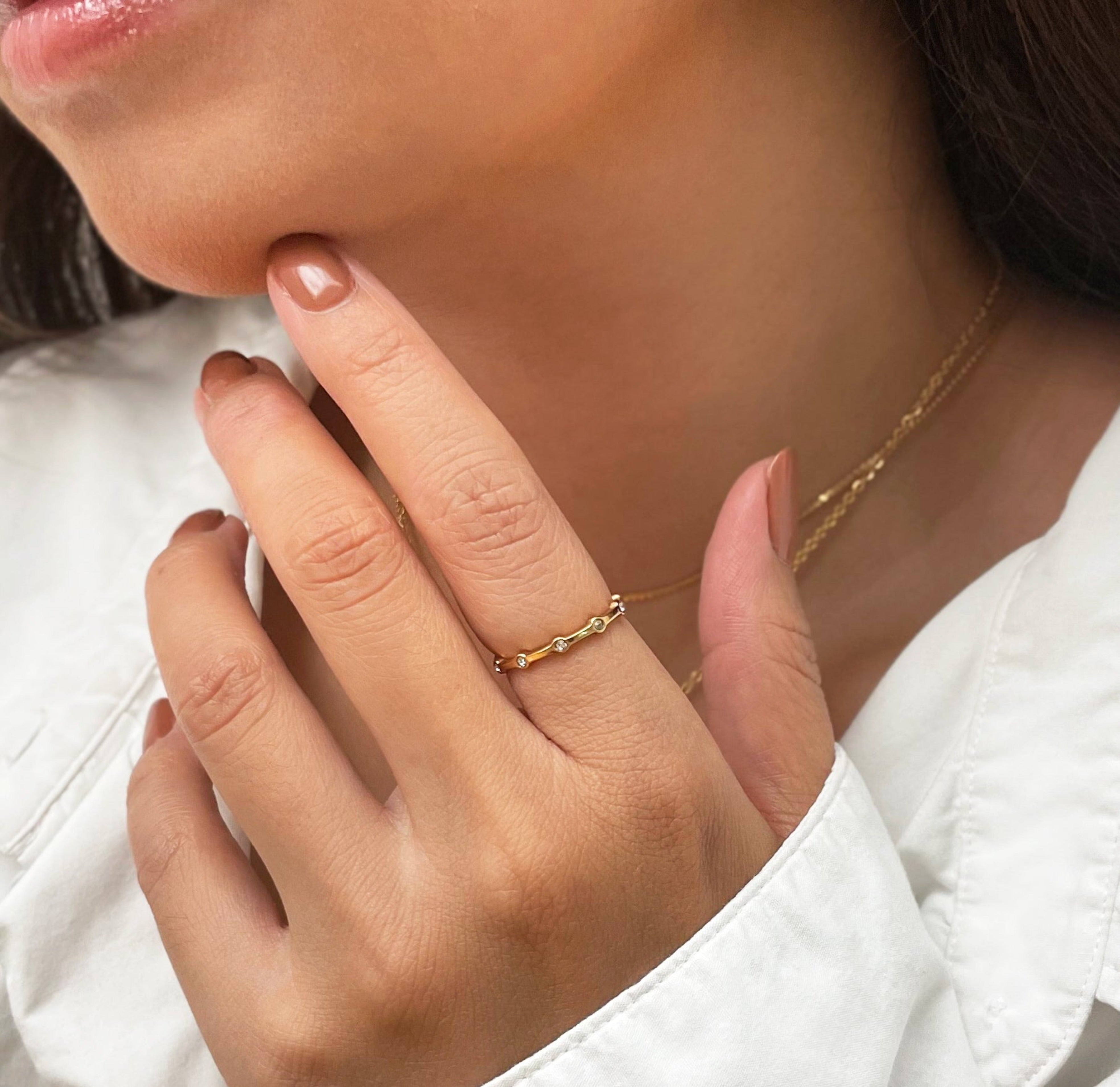 Daphne thin dainty gold pave ring worn on model, waterproof jewelry