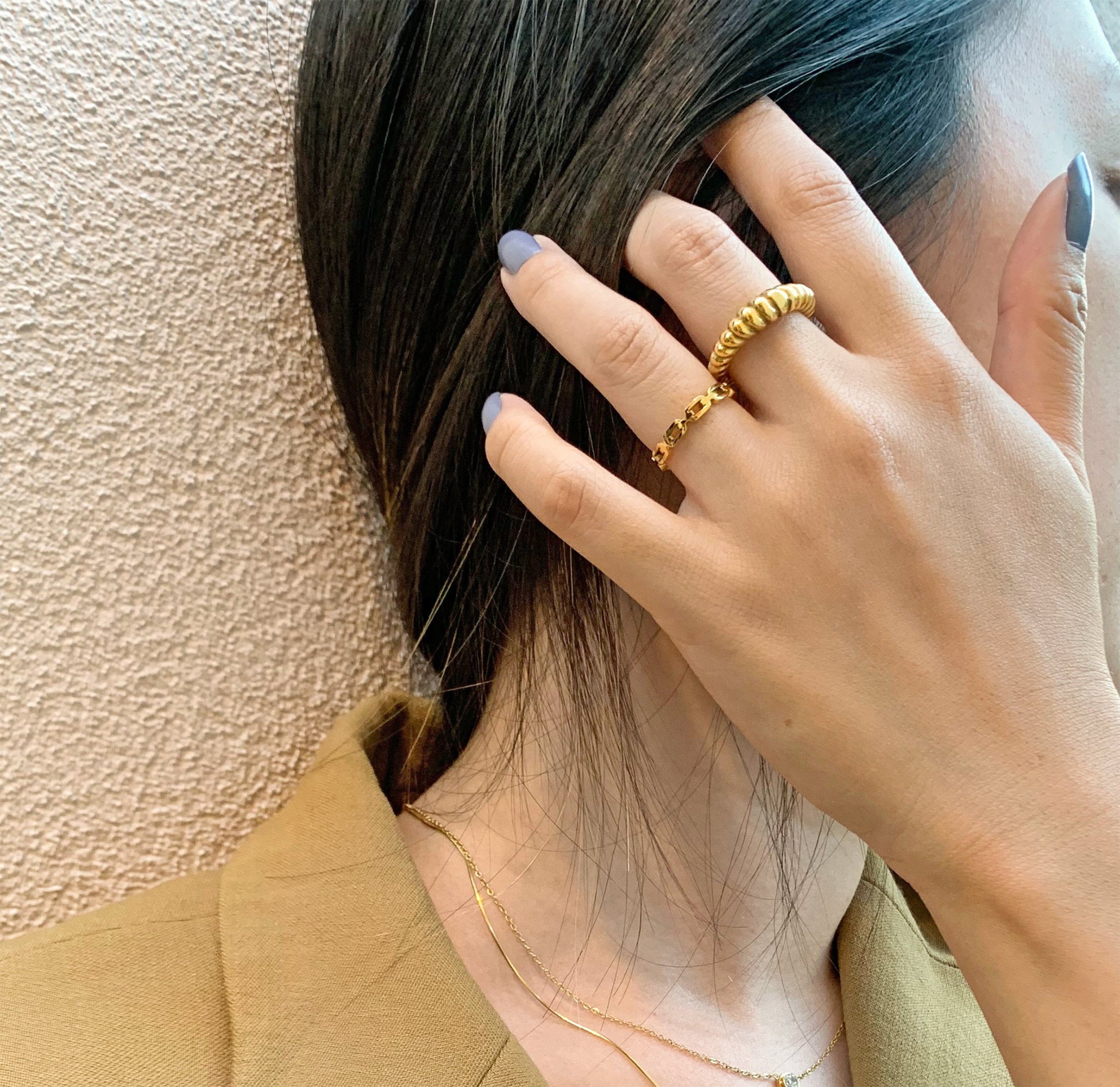 Dainty gold chain ring stacked with gold croissant ring waterproof rings