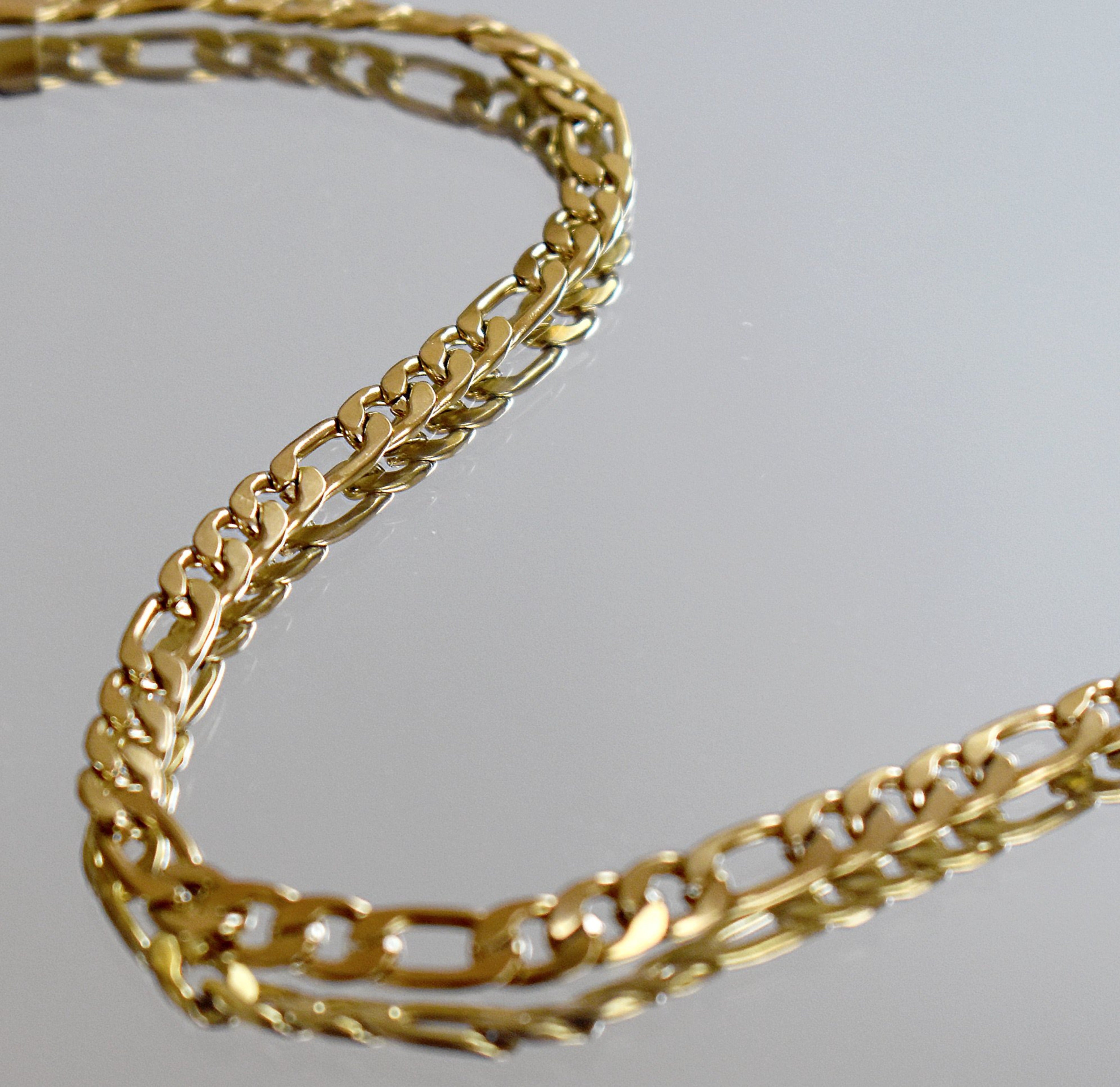 gold figaro chain necklace