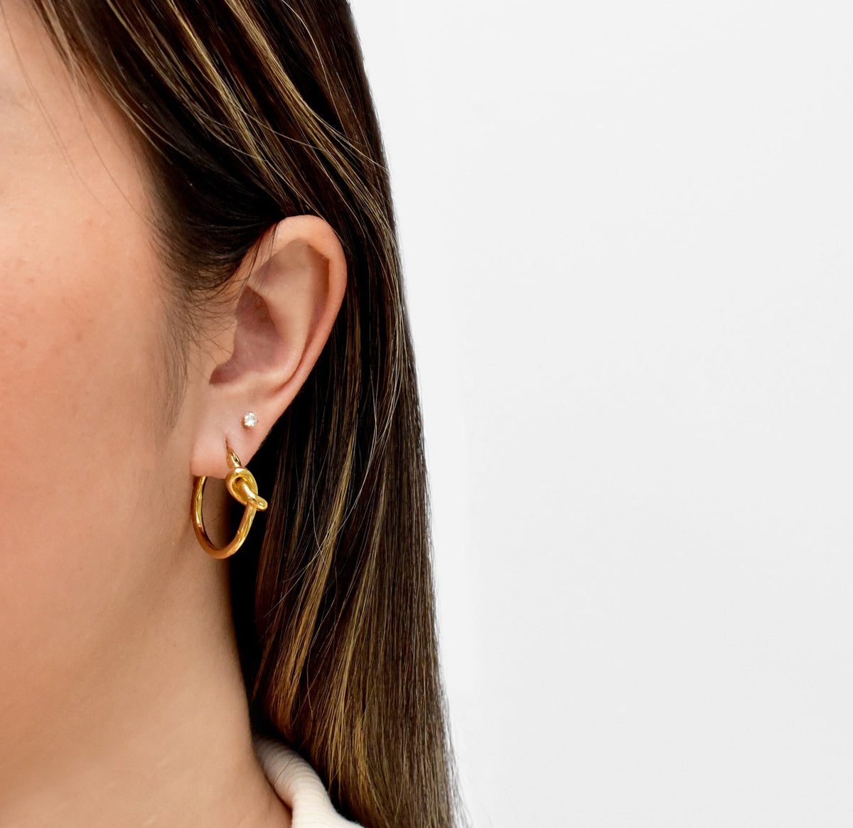 gold hoop earrings with knot