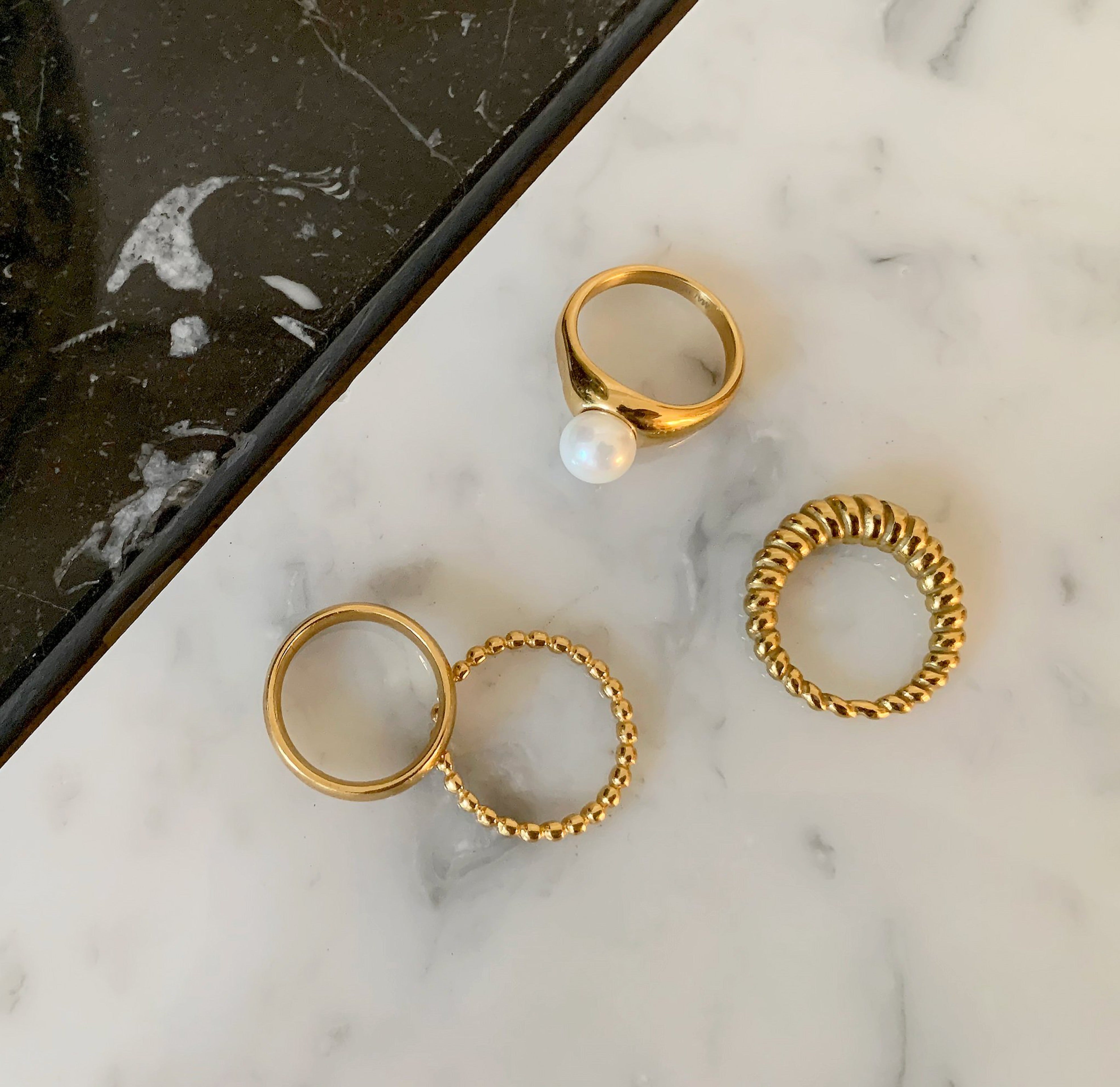 various styles of waterproof gold rings