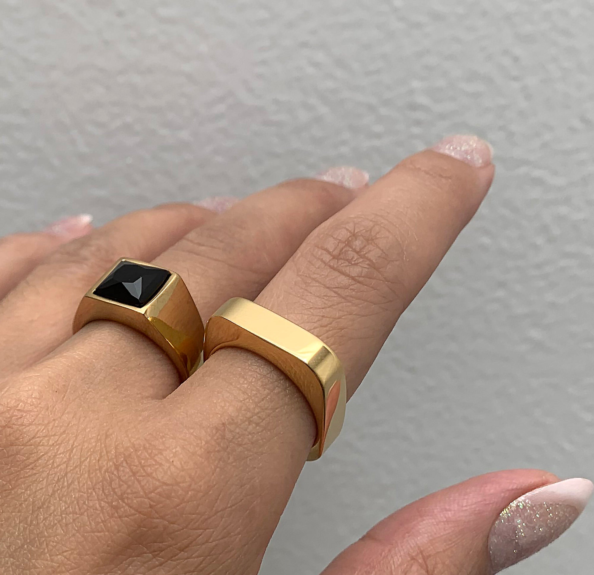 Whitney gold square ring paired with Chicago black onyx signet ring. Gold waterproof rings