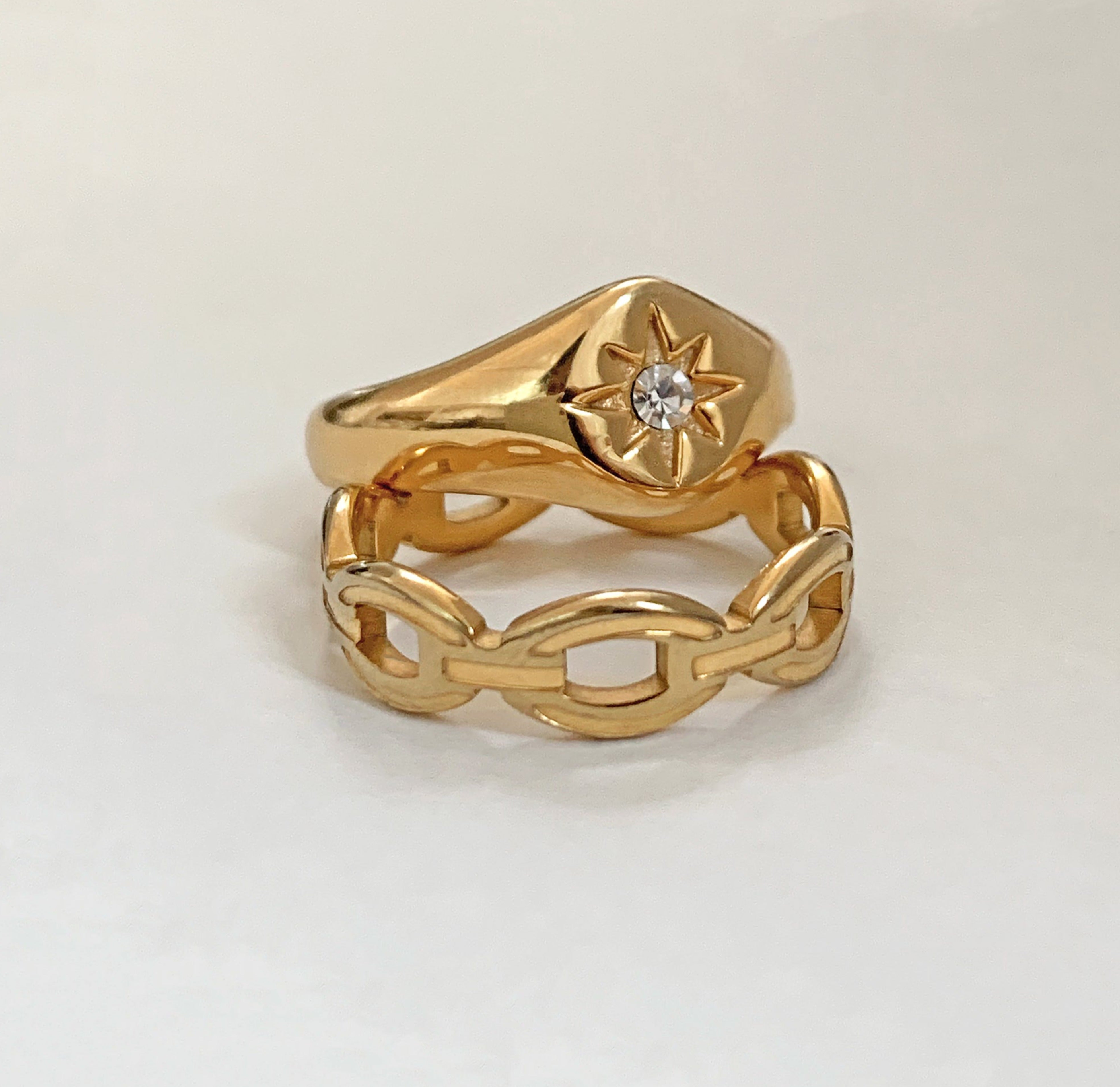 Dylan gold link chain ring paired with August gold starburst sight ring, watereproof jewelry