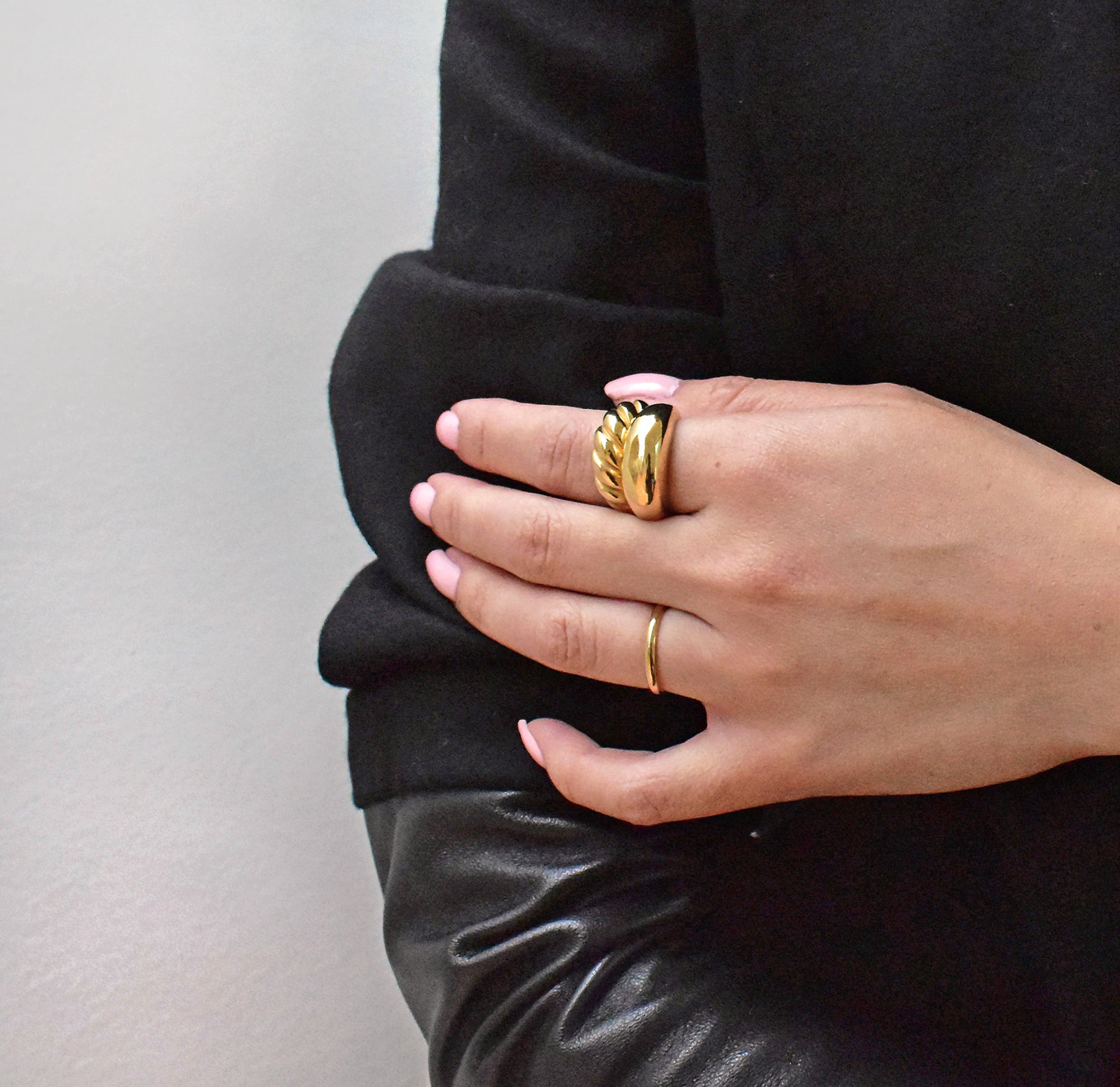 Didi thin gold ring band paired with Margaux gold croissant ring and capri gold dome ring worn on model, waterproof rings