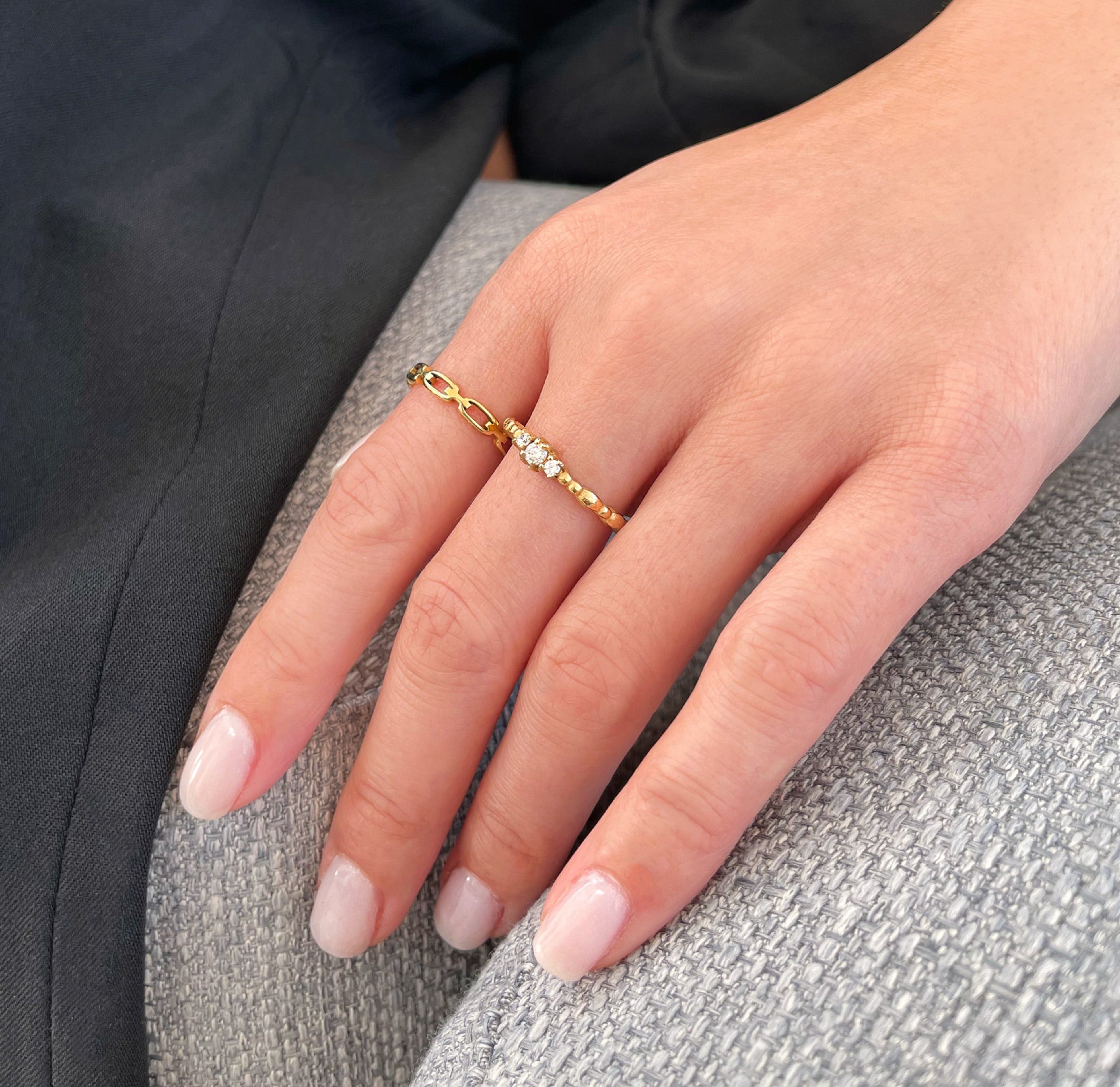 Celeste gold dainty trim stone ring paired with Bebe thin chain ring.  Waterproof jewelry