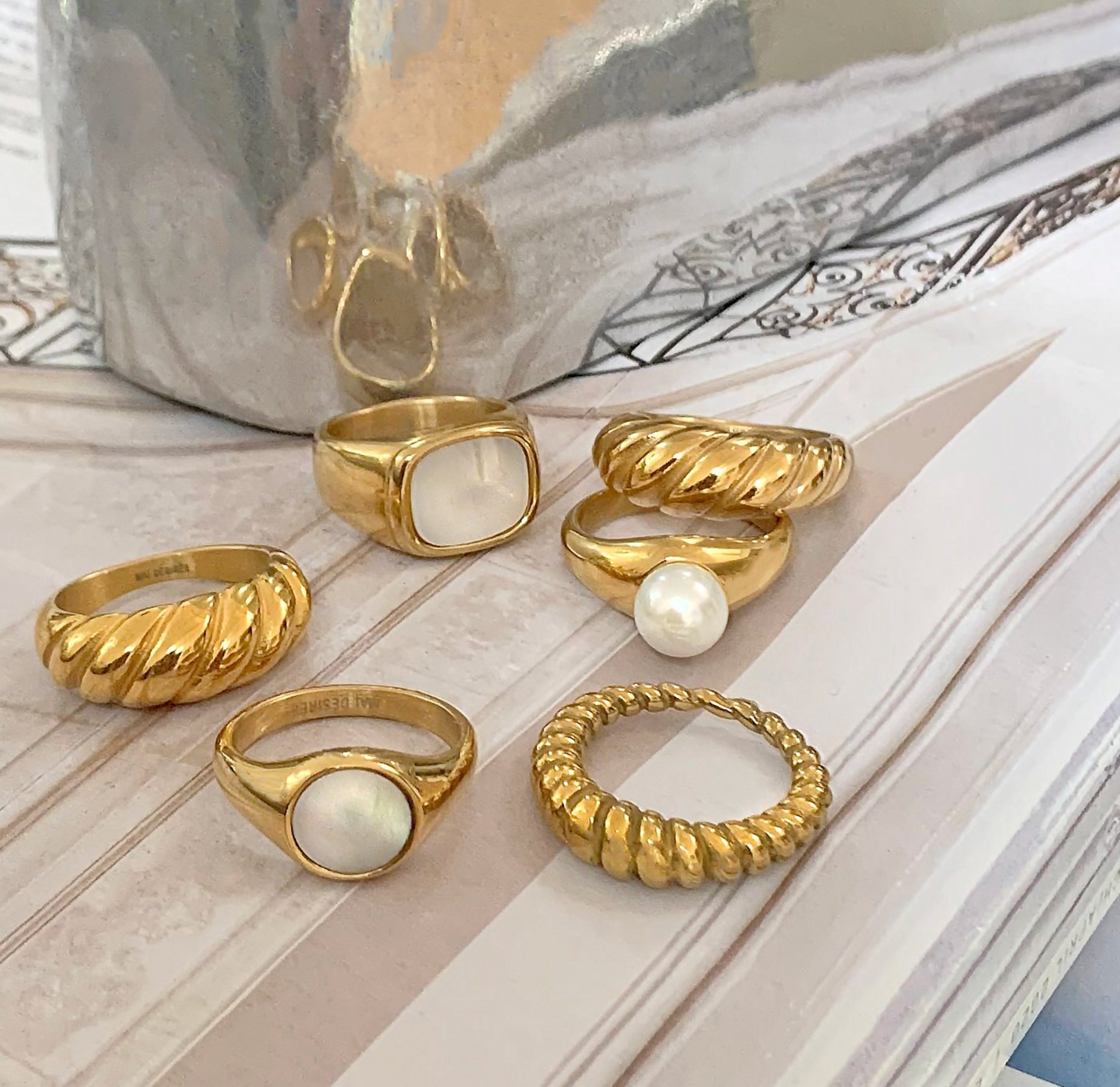 Various styles of gold waterproof rings