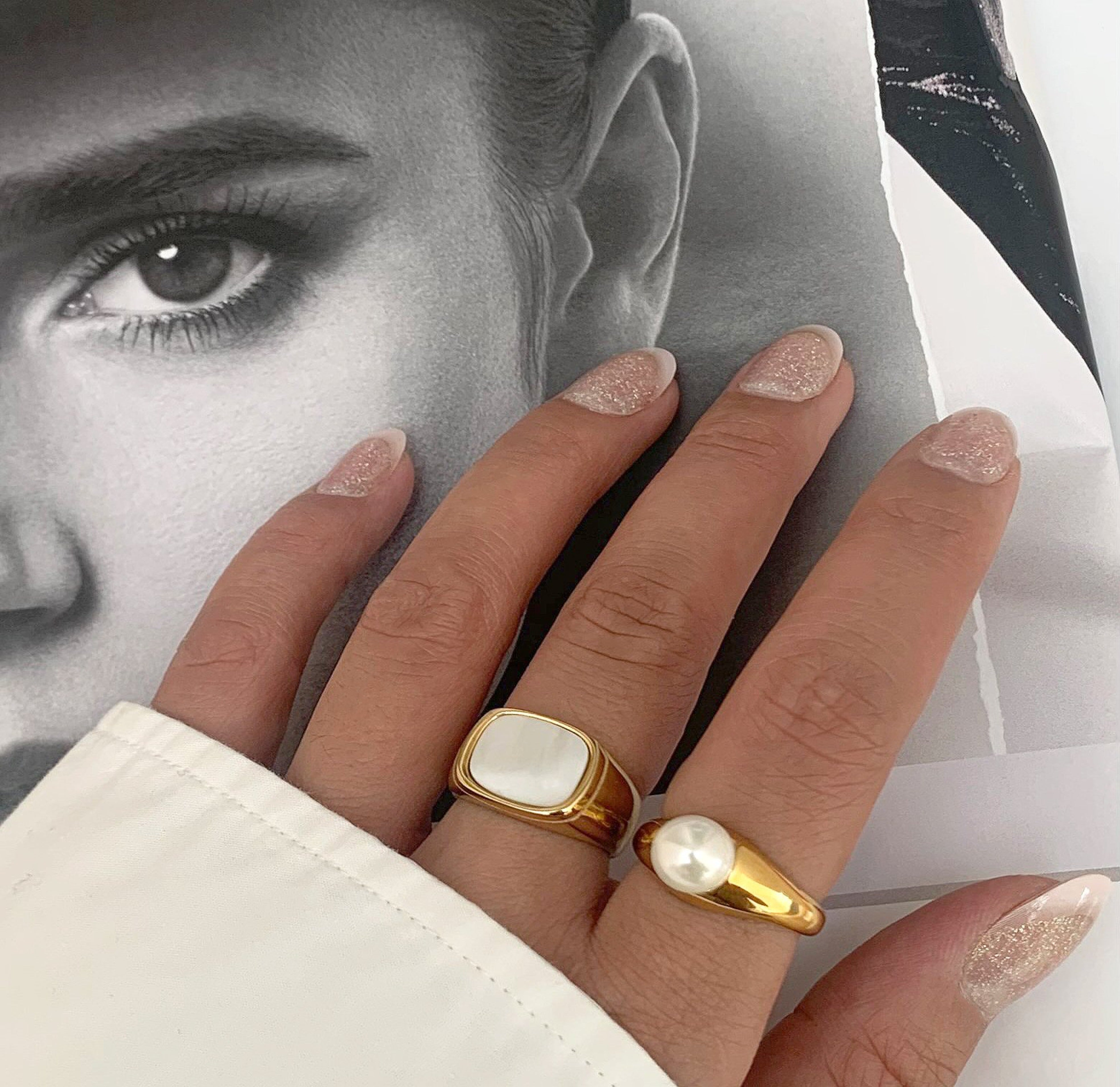 Thea gold square pearl signet ring  paired with June pearl ring. Gold waterproof