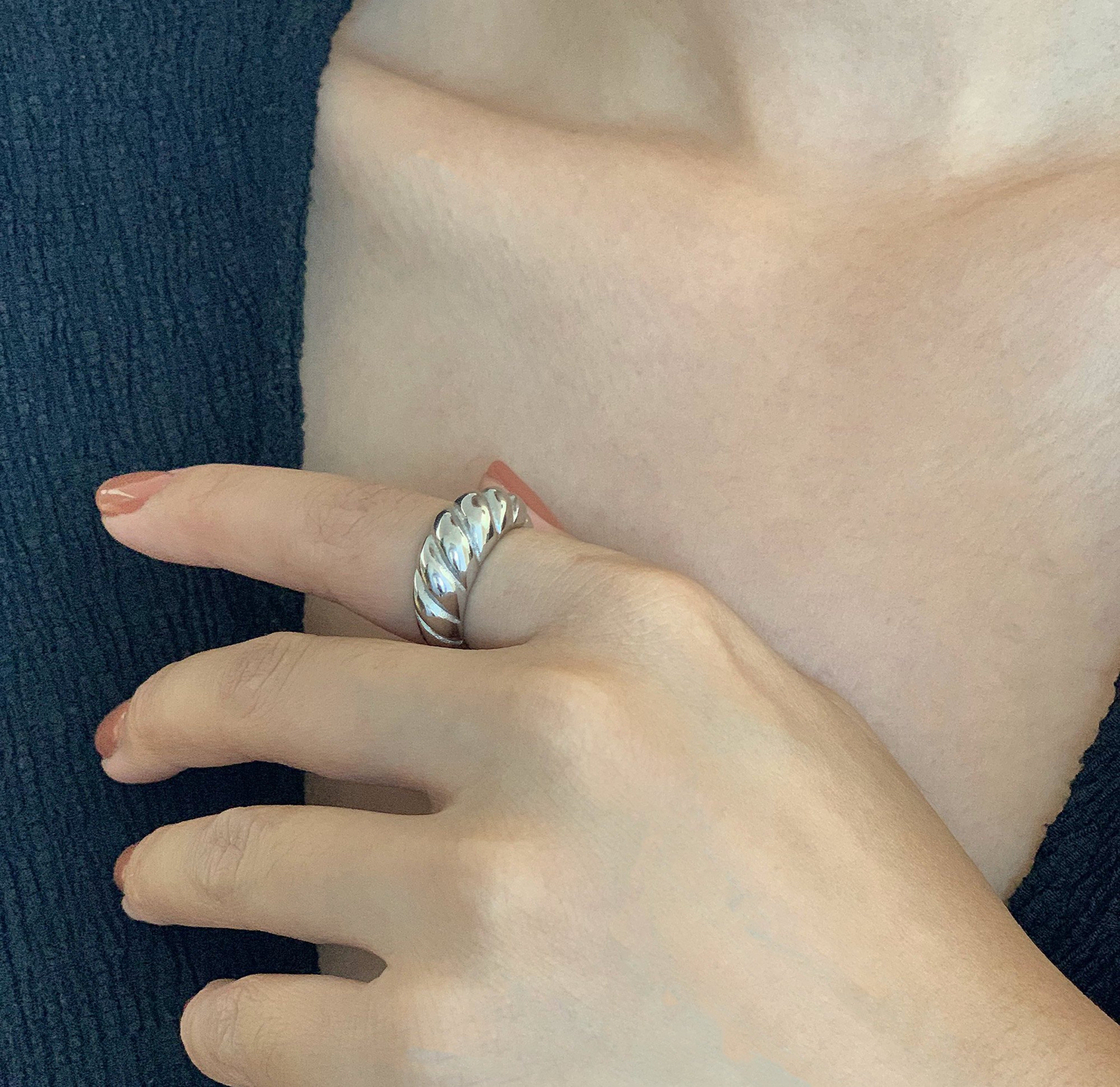 Silver classic croissant ring worn on model. Waterproof rings