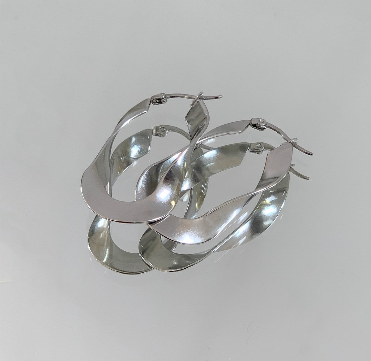 silver twist hoop earrings modern jewelry