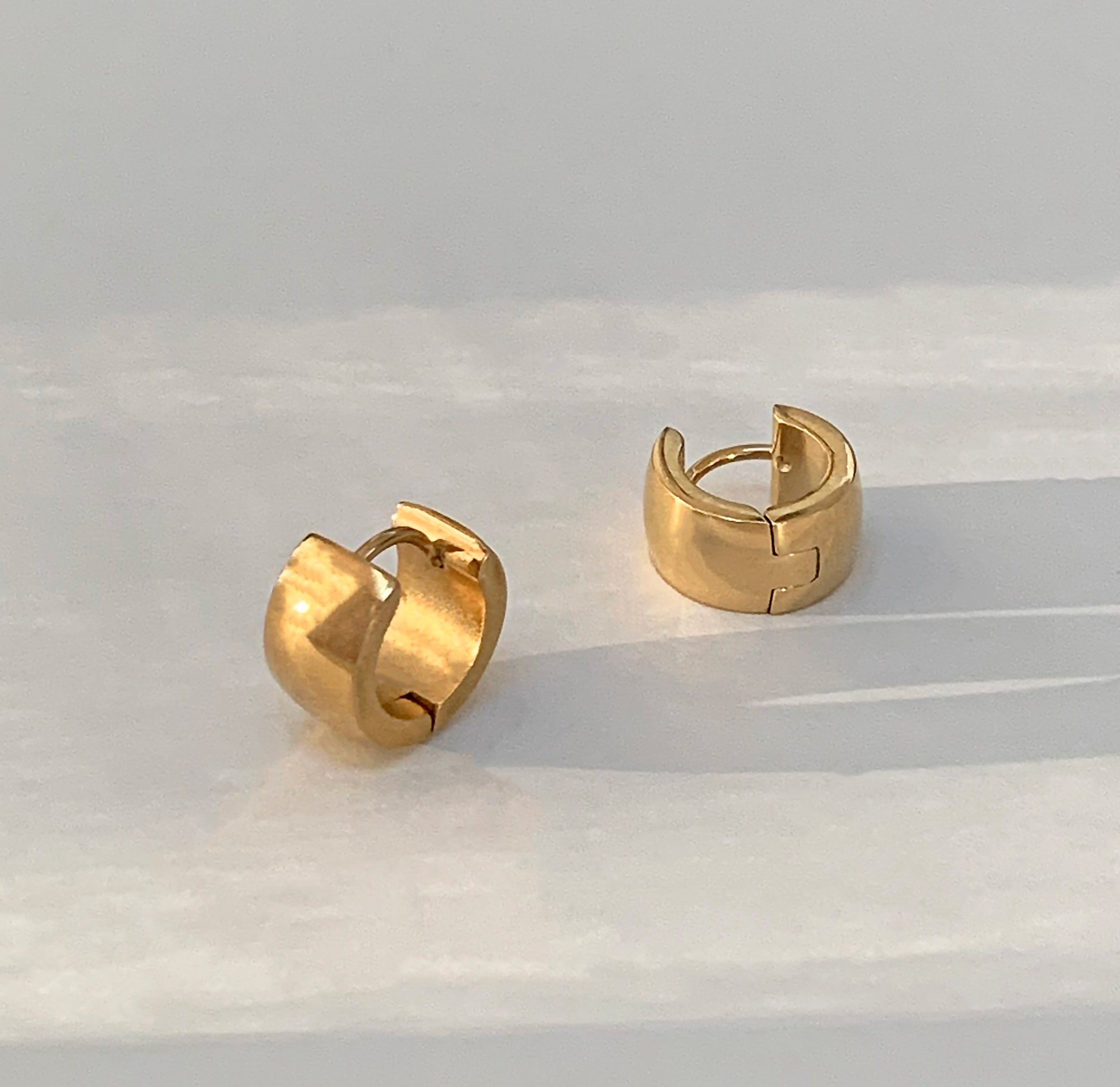 thich gold huggie earrings
