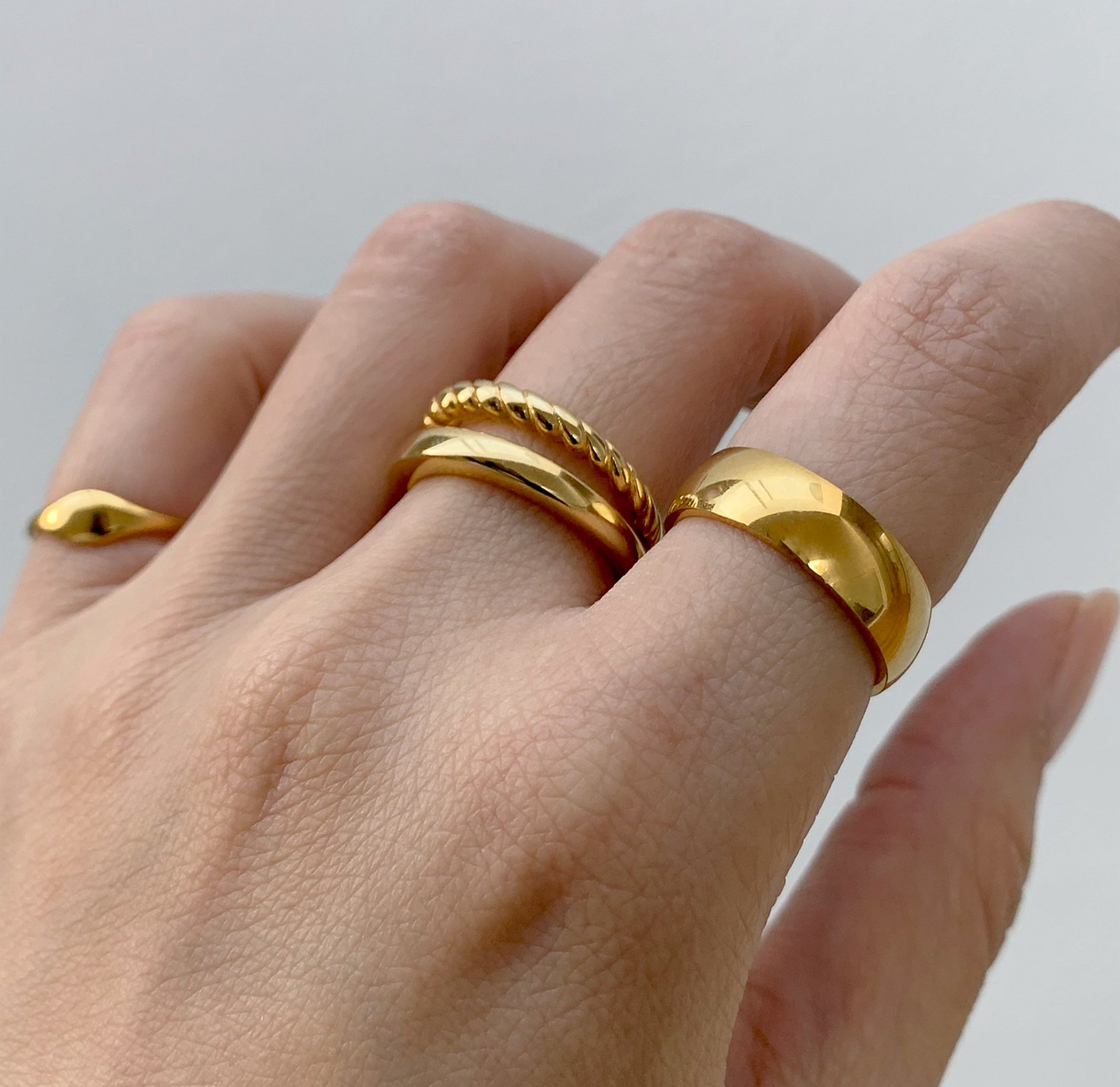 Drew dainty gold signet pinky ring, paired with Birds duo ring and Toni thick gold ring band. Waterproof rings